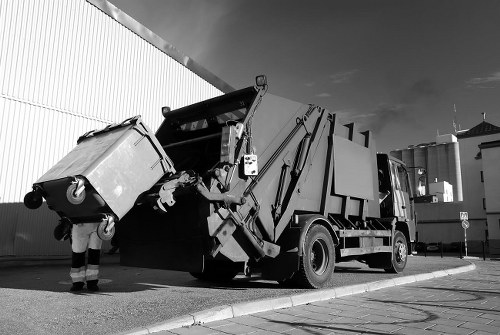 Sorting recyclable materials like glass and cardboard at a transfer station