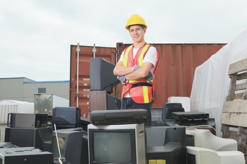 Workers sorting and handling waste safely at a collection point